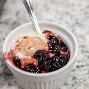 Cherries Jubilee flambé served during a hands-on cooking class